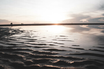 sea sand and the sunset along the beach