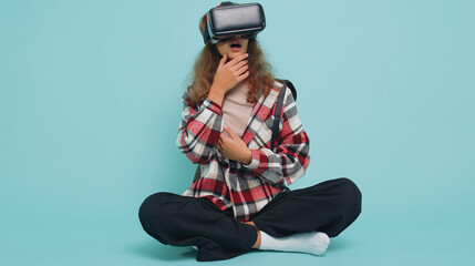 Teenager child girl kid using virtual reality futuristic technology VR app headset helmet to play...
