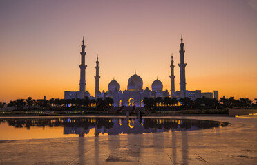 Tourists visit the Sheikh Zayed Grand Mosque. Night time view opposite the grand mosque. 