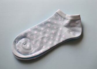 women's socks with polka dots on a blue background