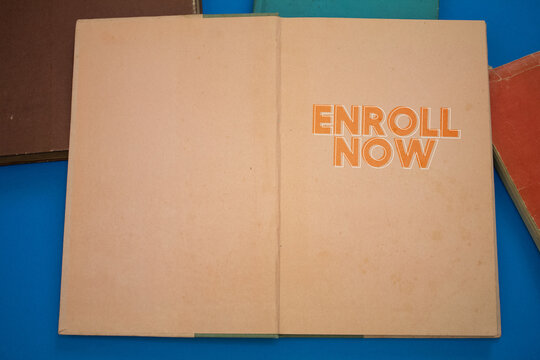 Enroll Now word in opened book with vintage, natural patterns old antique paper design.