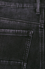 Part of dark jeans.