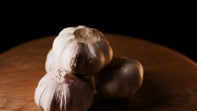 Garlic isolated on black background rotating