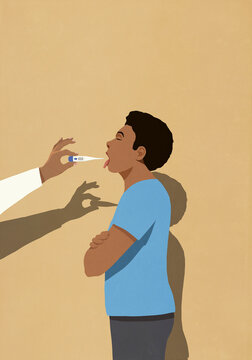 Doctor inserting thermometer into open mouth of male patient
