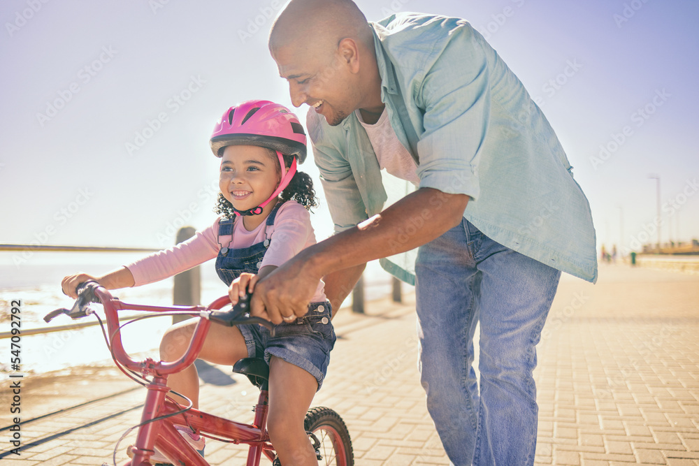 Sticker Black girl, bike and learning with dad, smile and park in sunshine, safety or happiness by sea. Father, kid and bicycle for summer training, childhood development and outdoor in street with helmet