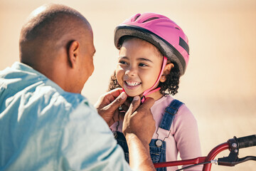 Bike safety, kid and helmet of a girl with father ready for cycling learning outdoor with a smile....