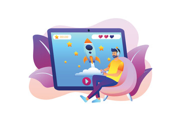 Gaming violet gradient concept with people scene in the flat cartoon design. Boy plays computer games on a large tablet. Vector illustration.