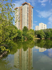 A large house near a small pond