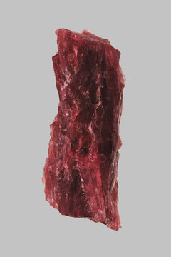 Close up red Madagascar tourmaline on gray background
