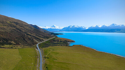 Aerial view of Landscape view of  mountain range near Aoraki Mount Cook and the road leading to Mount Cook Village in New zealand