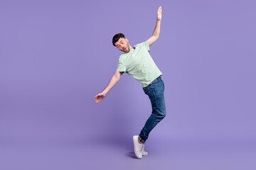 Fototapeta na wymiar Full length photo of frightened crazy impressed man stand toes look floor empty space falling down isolated on purple color background
