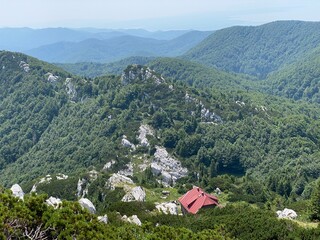 Obraz premium The Josip Schlosser Klekovski mountain hut in the Risnjak National Park - Croatia (Planinarski dom Josip Schlosser Klekovski ili Schlosserov dom u nacionalnom parku Risnjak, Crni Lug - Gorski kotar)