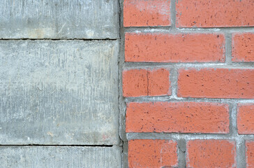 Close Up of Wall with Joint between Bricks and Concrete Blocks 