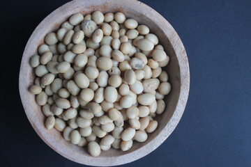 lamtoro seeds on a black background