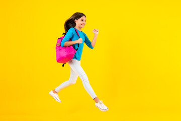 School teen with backpack. Teenager student, isolated background. Learning and knowledge. Go study. Run and jump. Education concept. Happy teenager portrait. Smiling girl.