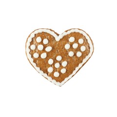 Decorated Christmas gingerbread heart. Homemade gingerbread in a shape of heart on white background. Flat lay.