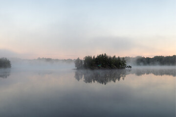 morning mist on a forest lake