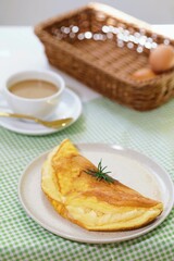 Delicious homemade Cheese Omelet on table, breakfast table.