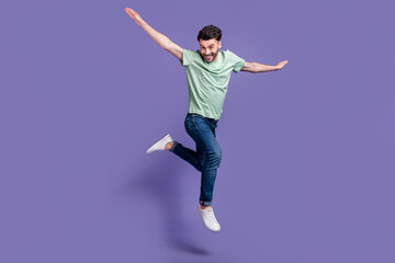 Fototapeta na wymiar Full length photo of cool overjoyed man dressed stylish clothes dream flight abroad resort vacation isolated on purple color background