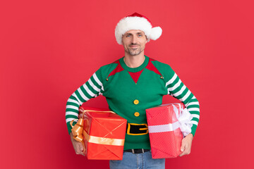 xmas guy with present box on red background. happy new year. merry christmas gift.
