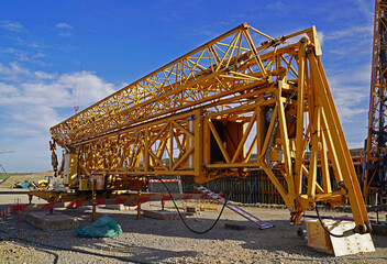 Folding crane mounting on a bridge construction site for the overpass of a service road over the future A143 motorway