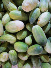 close up of a pile of cucumbers