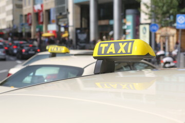A yellow taxi sign in Cologne, Germany