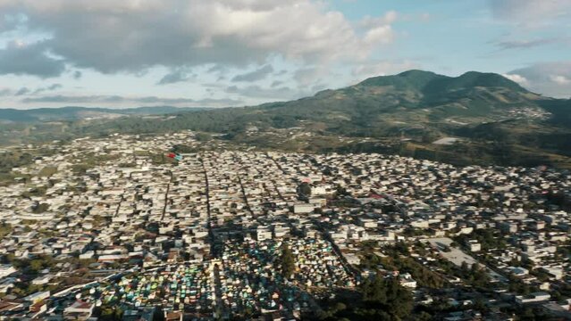 Panoramic View Of Sumpango Town With Flying Giant Kite In Sacatep&eacute;quez, Guatemala. Aerial Panning Shot