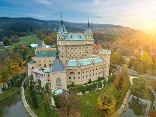 Fototapeta na wymiar Bojnice Castle. Aerial view of neo-gothic romantic, fairytale castle in colorful autumn landscape. UNESCO heritage landscape travel concept. Slovakia. 