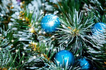 Fototapeta na wymiar Christmas blue decoration close-up on spruce branches. Christmas and New Year holidays background.