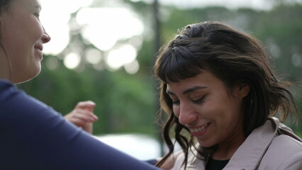 Two friends hugging each other standing outside with EMPATHY and SUPPORT. Friendship concept of female friend EMBRACING suffering person2