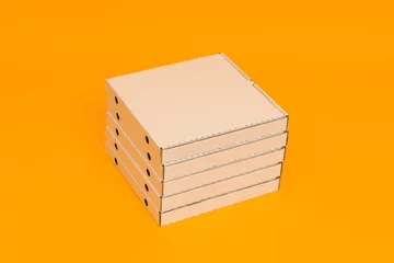 Foto op Canvas pizza boxes stacked on yellow background © Sergey