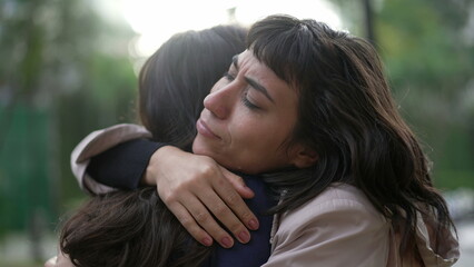 Sympathetic woman hugging friend with EMPATHY and SUPPORT. Friendship concept between two best...