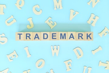 Trademark business concept. Word typography on wooden blocks flat lay.	