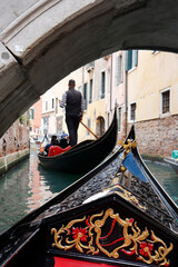 Fototapeta na wymiar A very romantic gondola ride in Venice.
