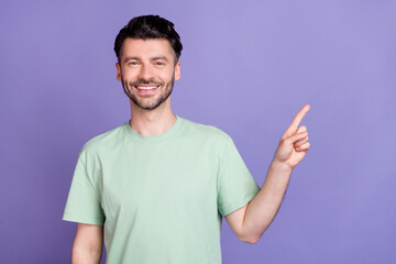 Close up photo of positive man dressed stylish clothes satisfied low price arm direct empty space isolated on purple color background