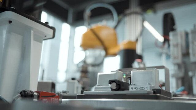 Robotic arms working on a production line at automotive factory