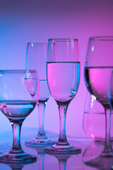 Wine glasses with neon multicolor light