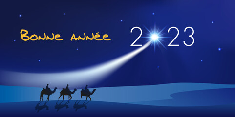 Fototapeta premium Carte de vœux 2023 montrant les trois rois mages à dos de dromadaire se dirigeant vers Bethléem avec des cadeaux pour célébrer la naissance de Jésus Christ.