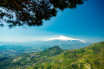 Taormina, Sicily. View of town, theater and Etna