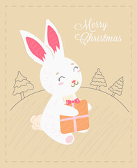 CHRISTMAS CARD CUTE RABBIT HOLDING A GIFT ON THE BACKGROUND OF THE FOREST