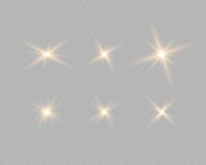 Set of golden glowing circles of light burst, star, explosion on a transparent background.