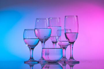 Wine glasses with neon multicolor light