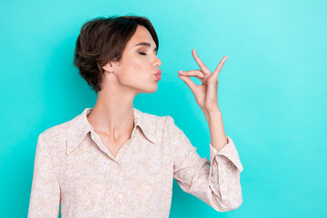 Photo of cute bob hairdo young lady eat tasty wear white shirt isolated on teal color background