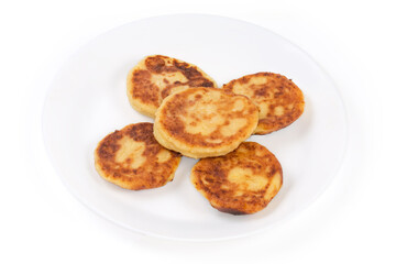 Fried cheese pancakes on dish on a white background