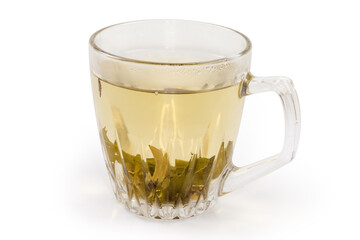 Brewed green tea in the glass cup on white background