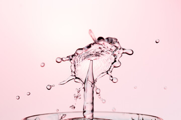 Obraz na płótnie Canvas Water Drop Splash with Ripples on water surface