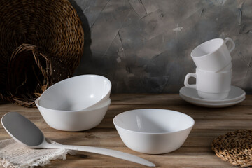 White ceramic tableware on a wooden table