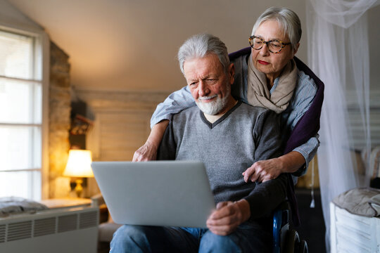 Loving older couple in a nursing home together. Senior people technology concept