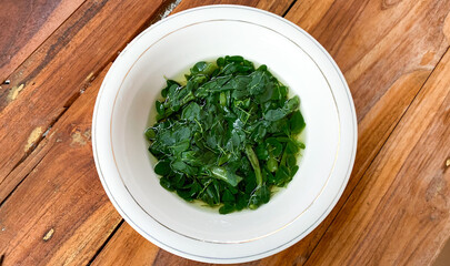 bowl of moringa oleifera or drumstick vegetable soup.